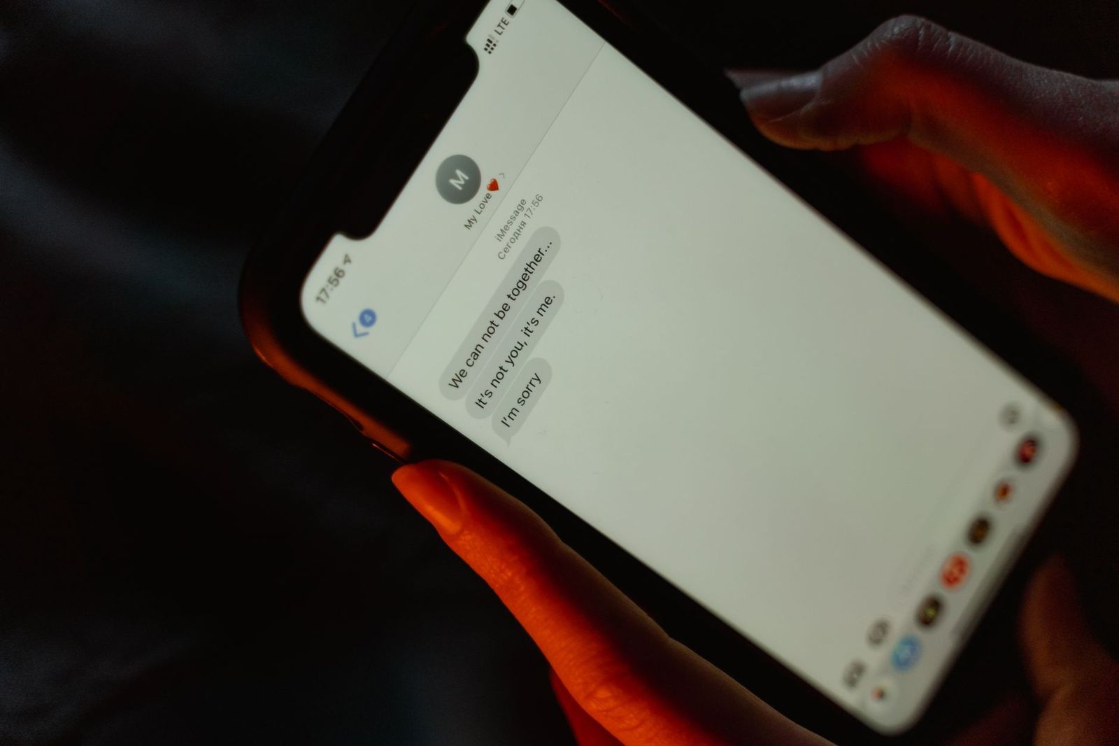 a close-up of a phone screen with an actual text thread, two-word replies visible on one side. || close phone screen with actual text thread two word replies visible one side