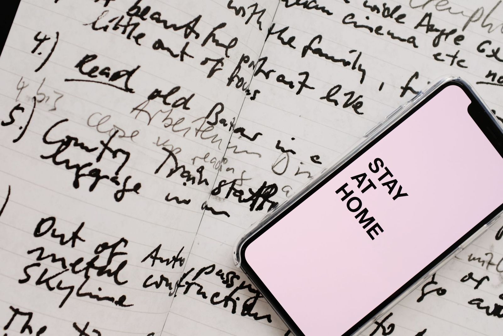 phone charging kitchen counter with handwritten note beside