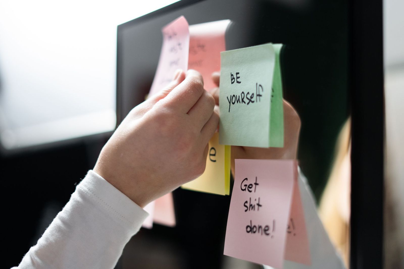 a sticky note on a bathroom mirror in morning daylight, handwriting visible, a toothbrush in the foreground || sticky note bathroom mirror handwriting visible toothbrush the foreground