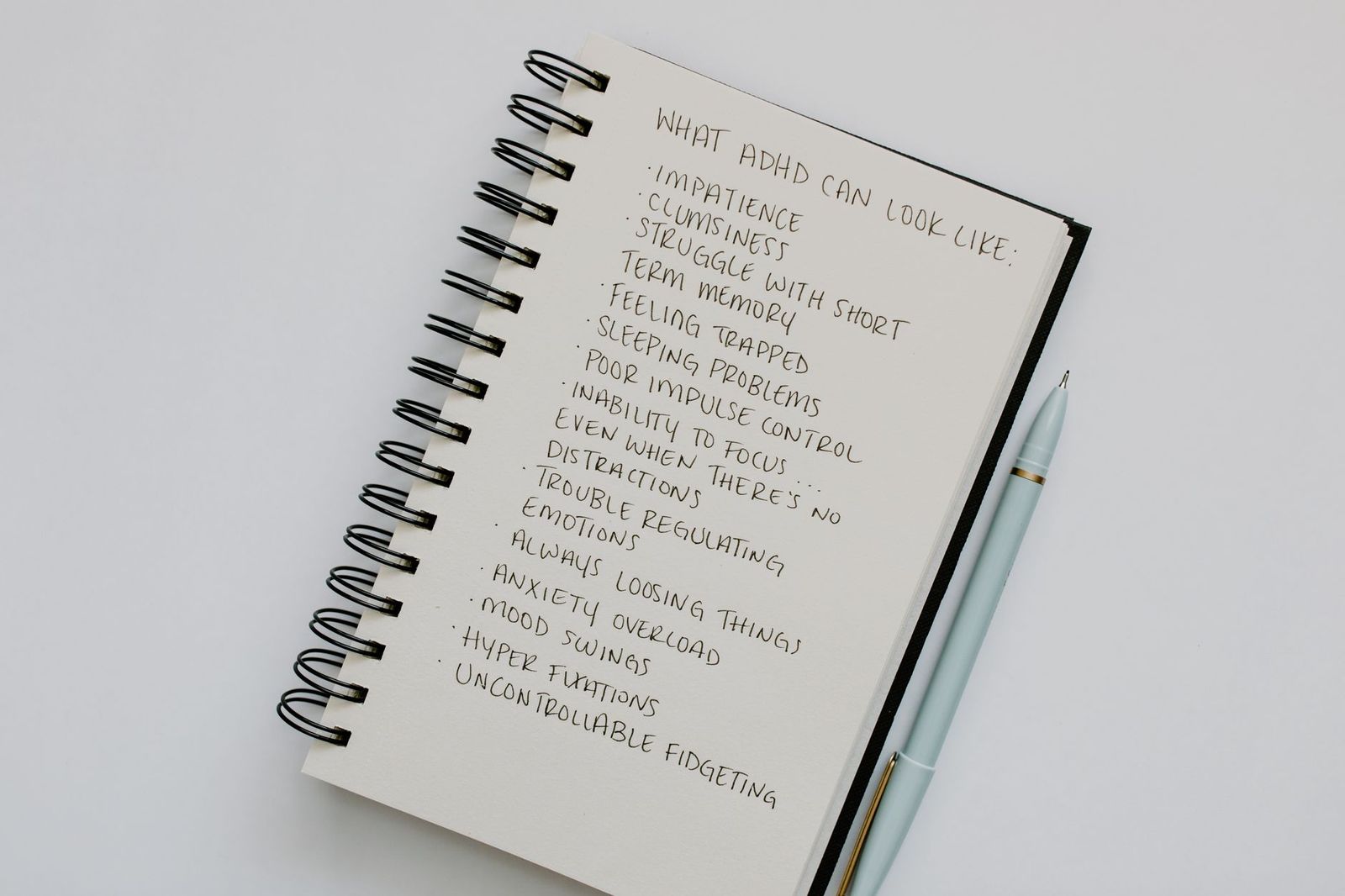 an open notebook with a handwritten list || open notebook with handwritten list